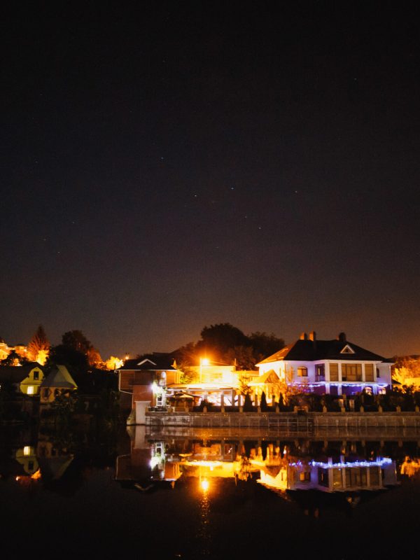 illumination of night wedding celebration near the lake